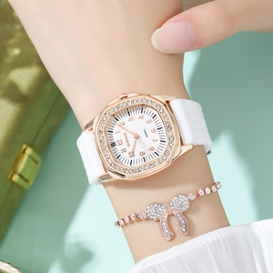 Close-up of white silicone square watch and sparkling crystal bow bracelet set for women