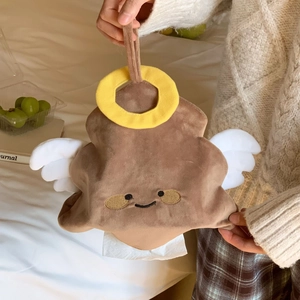 Detail of plush cartoon tissue holder with white wings and yellow halo in use