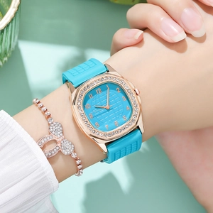 Close-up of sky blue silicone watch with rhinestone bezel and matching bow bracelet
