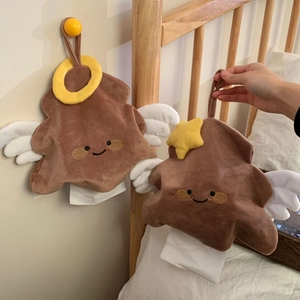Macro view of plush poop-shaped tissue holders with angel wings and hanging strap detail