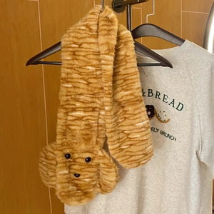 Plush caramel winter scarf with wave texture and cute puppy 3D character design