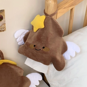 Close-up of a plush hanging star tissue holder with a smiling face and white wings