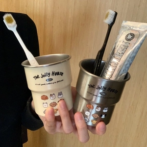Detail of stainless steel cartoon mugs with cute animal illustrations and easy-grip design