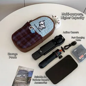 Checkered dog carry case for DJI Pocket 3 and accessories on white desk