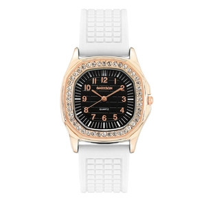 Detail of rose gold square watch with crystal bezel and white silicone strap