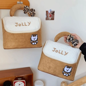 Macro detail of JOLLY embroidered plush makeup bag with leopard bow and cat motif