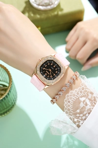 Close-up of luxury square quartz watch with rhinestones and matching heart bracelet