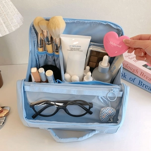 Detail view of large capacity makeup bag with specialized brush slots and compartments