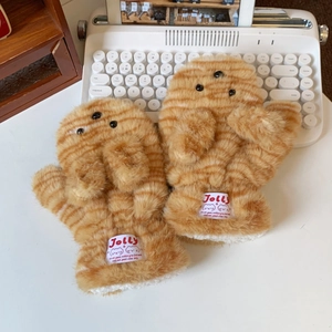 Detail of plush orange tabby mittens with thick fleece lining and cute cat face design