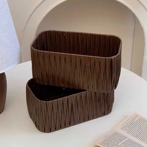 Set of two vintage dark brown desktop storage baskets with vertical pleated texture