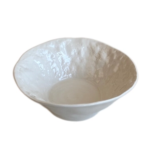 Minimalist white ceramic bowl with hammer texture and wide opening for salad and soup