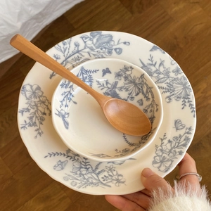 French vintage ceramic dinnerware set with blue floral patterns, plate and bowl