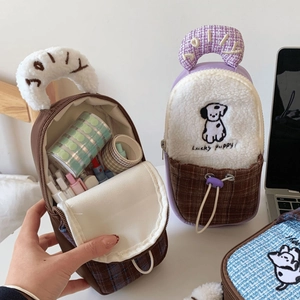 Detail showing the cute Lucky Puppy embroidery and soft corduroy texture of the pouch