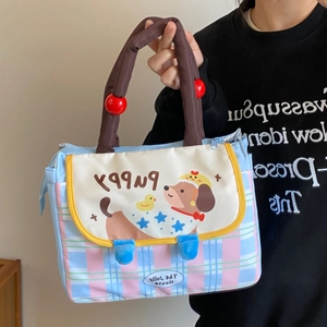Detail of cute dachshund plaid lunch bag with puppy print and soft brown handles