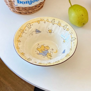 Detailed ceramic bowl showing Little Prince cartoon patterns with moon and star motifs