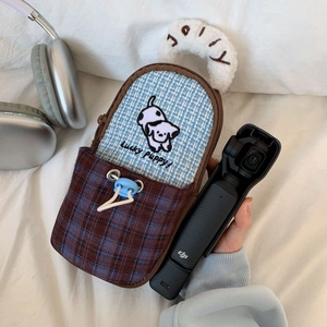 Detail of cute Lucky Puppy storage bag with soft plush handle and DJI Pocket 3 camera