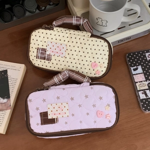 Quilted pouch with heart patterns, fabric handles and cute dot or star motifs