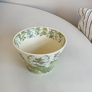 Detailed top view of a ceramic lily of the valley bowl with fresh floral patterns