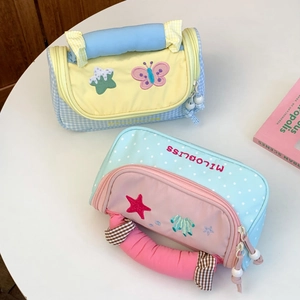 Detailed top view of large capacity quilted stationery bags with butterfly embroidery