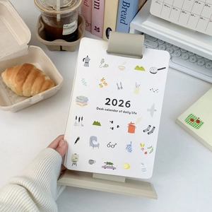 Detailed view of a 2026 vertical desk calendar with minimalist clips and colorful illustrations