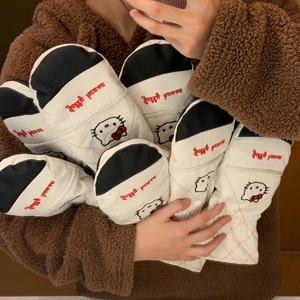 Detailed close-up of Hello Kitty embroidery on waterproof quilted ski mittens for winter