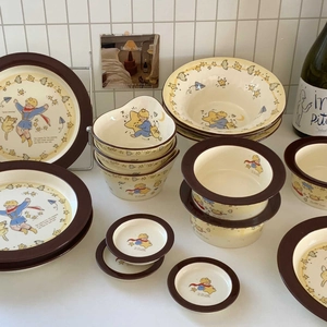 Detail of Little Prince ceramic tableware set with star patterns and beige glaze
