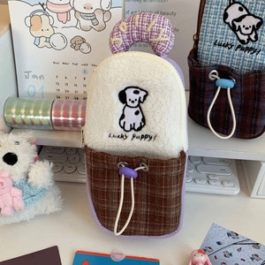 Detail of cute DJI Pocket 3 storage bag featuring plush puppy embroidery and plaid pocket