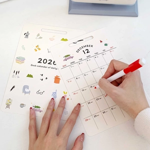 2026 minimalist illustrated desk calendar with monthly planner cards and writing pen