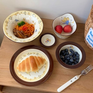 Detailed view of The Little Prince ceramic tableware set featuring stars and fox illustrations
