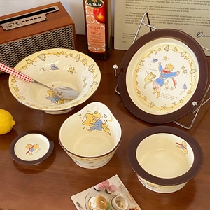 Le Petit Prince ceramic tableware set with bowl plate and spoon on rustic wooden table