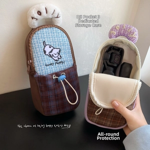 Detail of DJI Pocket 3 storage bag featuring padded compartments and lucky puppy embroidery