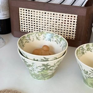 Close-up of lily of the valley ceramic bowls with elegant vintage floral patterns
