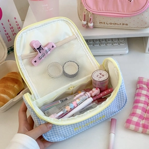 Detail showing inner mesh compartments and multi-layer storage of the checkered pencil case