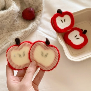 Red apple knit hair accessory with magic tape backing for effortless hair styling