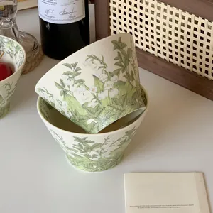 Detail view of Lily of the Valley ceramic bowls with rustic floral patterns