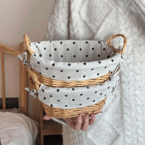 Handwoven wicker storage basket set with polka dot fabric lining and side handles