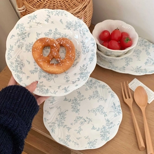 French retro ceramic dinnerware set with blue floral relief and wavy petal edges