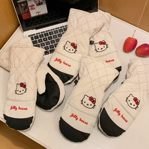 Detail of Hello Kitty embroidery and non-slip palm on white quilted ski gloves
