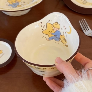 Detailed view of the Little Prince ceramic dessert bowl with irregular hand-painted edges