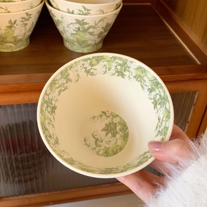 Close-up of a lily of the valley ceramic bowl with floral patterns in retro French style