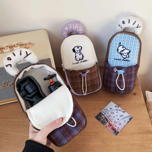 Detailed interior of plush checkered camera case with dog embroidery for Pocket 3