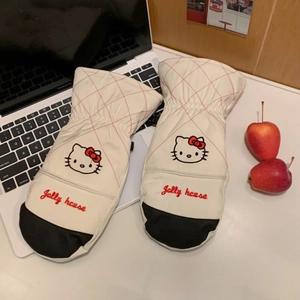 Close-up of cream quilted skiing gloves with cartoon cat embroidery and palm grip