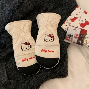 Detail of white quilted mittens featuring cute cartoon cat embroidery and elastic windproof cuffs