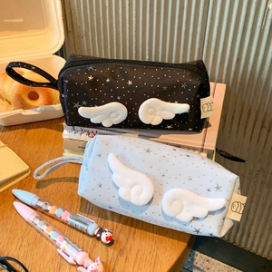 Detail view of large capacity star print pencil case with 3D plush angel wings