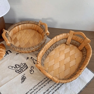 Detail of hand-woven wicker storage basket with intricate twine-wrapped handle