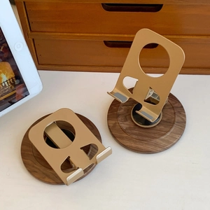 Foldable metal phone stand with walnut wood base showing flat and upright positions