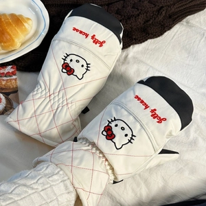 Detail of Hello Kitty winter mittens with quilted red diamond pattern and warm lining