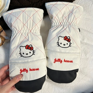 Detail of white quilted mittens with kitty embroidery and anti-slip black palms