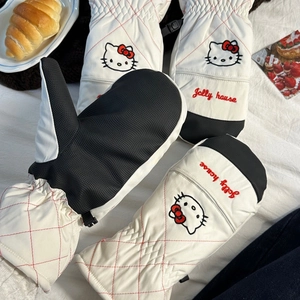Macro detail of cartoon cat ski gloves showing anti-slip palm texture and warm fabric