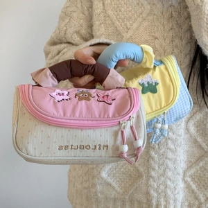 Detail of cute striped corduroy pencil case with star embroidery and soft cloud handle